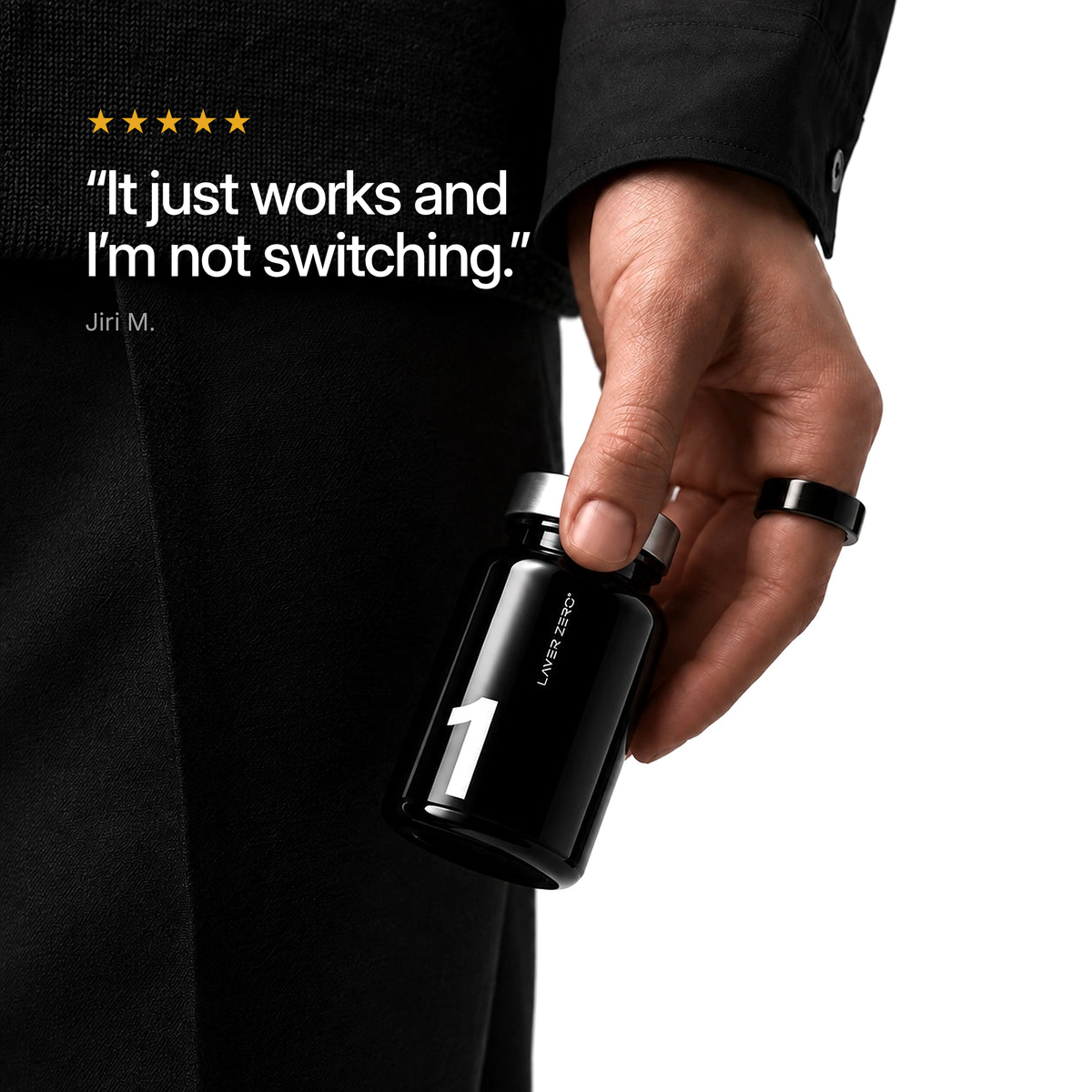 Hand holding LAYER ONE. Five-star customer review